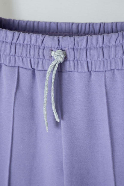 JOGGER DE MIC BOTA ANCHA MORADO PARA NIÑA