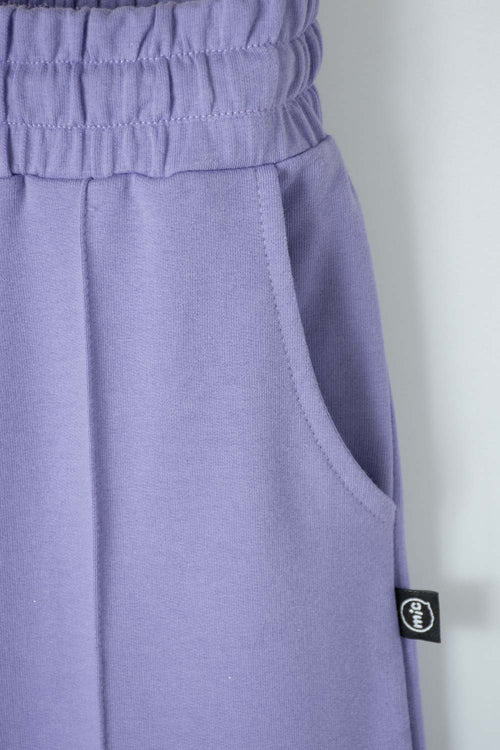 JOGGER DE MIC BOTA ANCHA MORADO PARA NIÑA